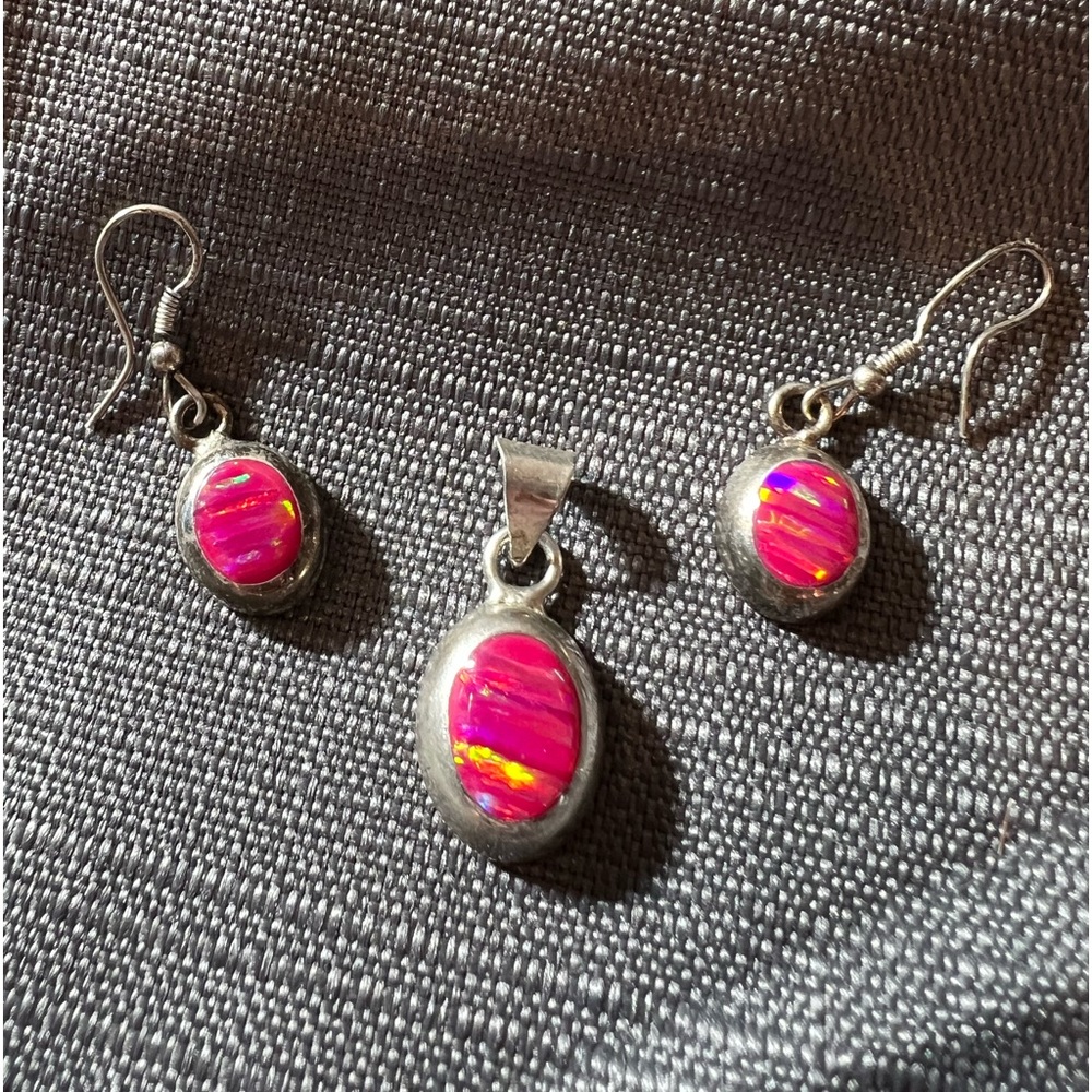 Authentic Mexican silver earrings and pendant set.